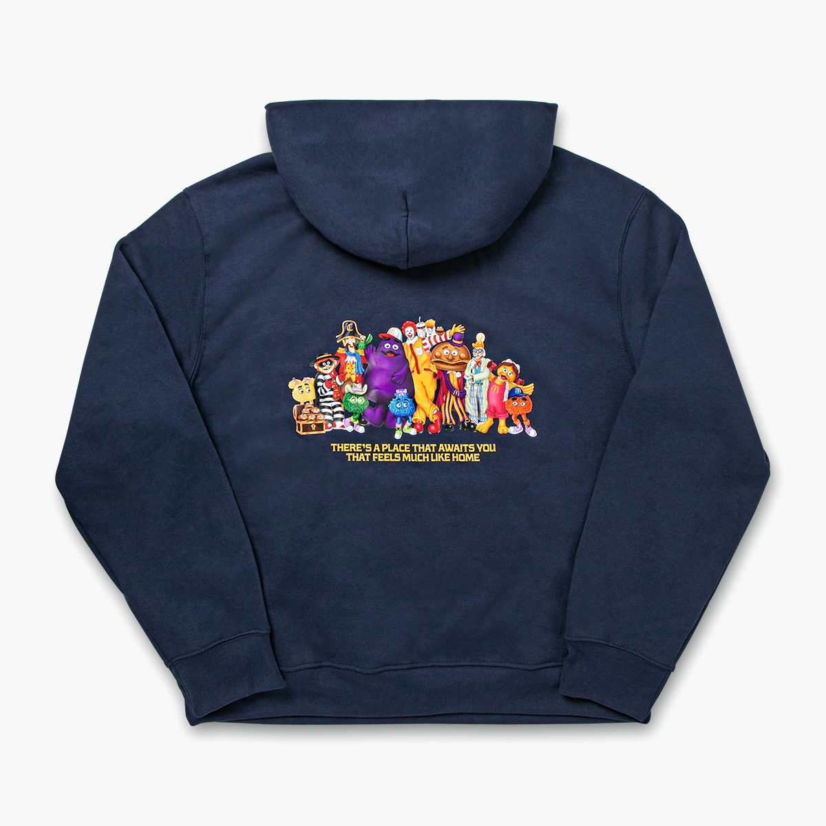 Back of hoodie with a group shot of McDonaldland's iconic characters above gold text that reads, "There's a place that awaits you that feels much like home"