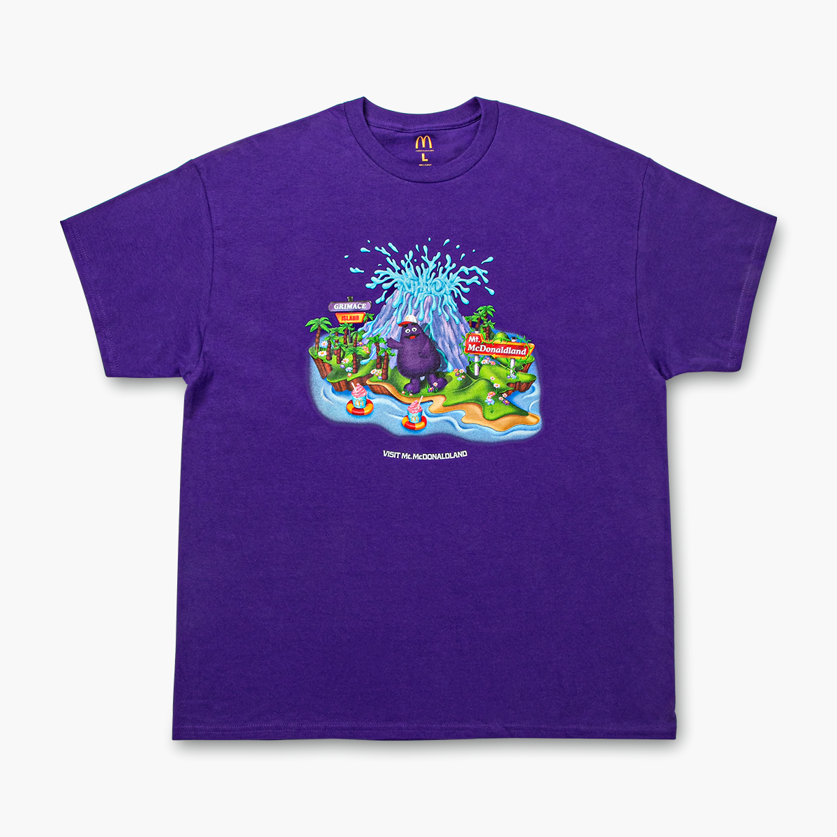 Front view of purple t-shirt with a large whimsical graphic of Grimace waving from Grimace Island