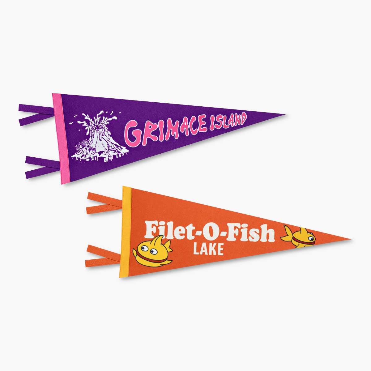 One orange and gold Filet-O-Fish pennant flag next to a purple and pink Grimace Island pennant flag