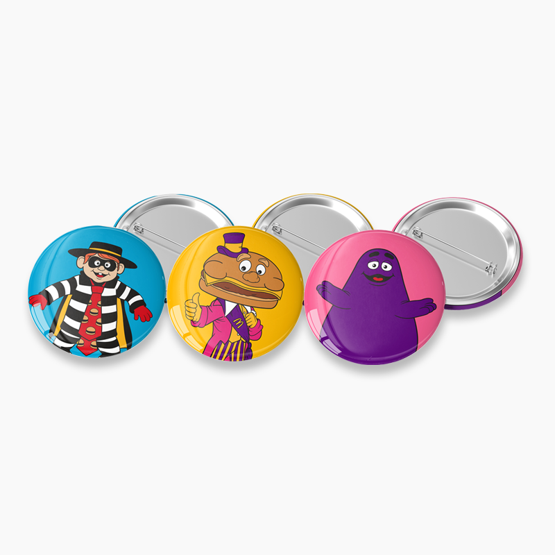 3 buttons with hamburglar, mayor mccheese and grimace on colored background