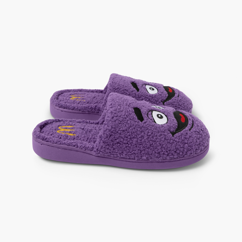 Side view Purple Grimace Slippers with Grimace Face and Golden Arches Logo on inner heel