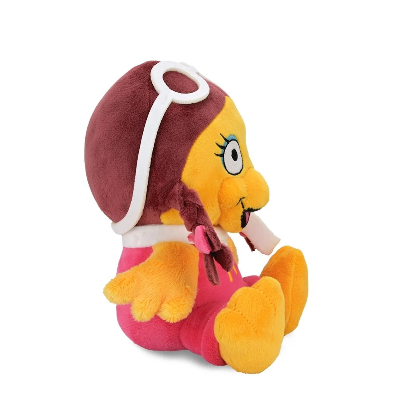 Side view of Birdie Phunny Plush by Kidrobot showing the character's profile, pink jumpsuit, white scarf, and braided pigtails.