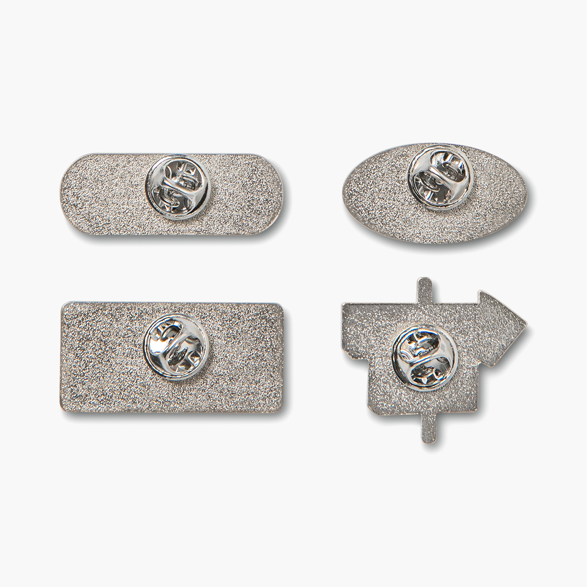 Close-up of enamel pin backs