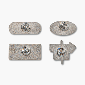 Close-up of enamel pin backs