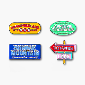 Close-up of colorful, nostalgic pin set featuring McDonaldland, Apple Pie Orchards, Sundae Mountain and Filet-O-Fish Lake