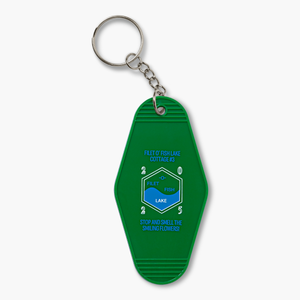 Green keychain with white-outlined Filet O' Fish logo with the year 2025 and light blue text that reads "Filet O' Fish Lake Cottage #3. Stop and Smell the Smiling Flowers!"
