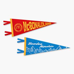 One gold and red McDonaldland pennant flag next to a blue, gold, and white Sundae Mountain pennant flag