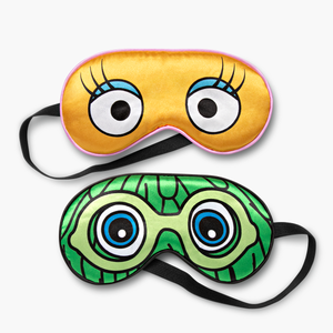 Set of 2 sleep masks with black strings. 1 Yellow mask featuring Birdie's eyes and lashes and 1 Green mask featuring the green Fry Friend's wacky hair, eyes and goggles.
