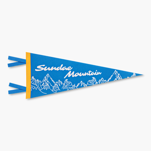 Close-up of blue, gold, and white Sundae Mountains pennant flag