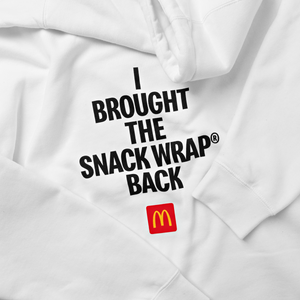 View Close-up of words “I Brought the Snack Wrap® Back” printed in black and McDonald’s logo underneath
