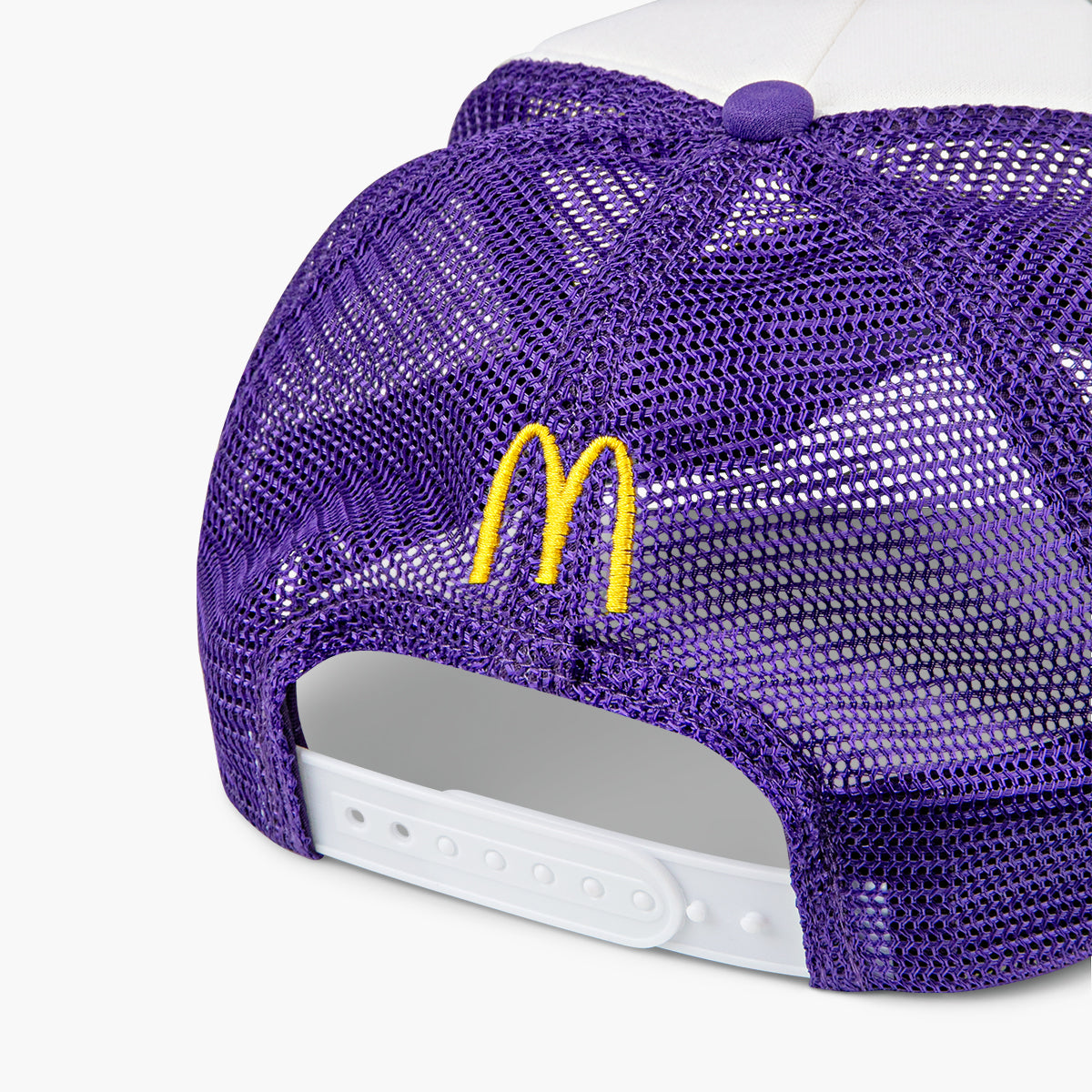 Purple mesh back of hat with McDonald’s logo and white adjustable strap