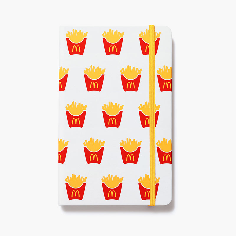 white journal with McDonald's fry pattern and yellow elastic strap closure