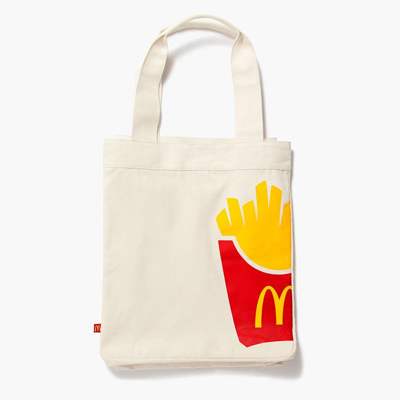 white tote bag with McDonald's fries graphic of yellow fries in a red sleeve with McDonald's logo