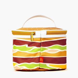 large round zippered bag appearing as a Big Mac Burger with layers of cheese, meat, lettuce and a bun and a handle on the top