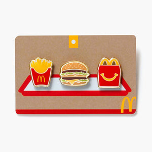 three pin set includes McDonald's fry box, Big Mac burger, and Happy Meal