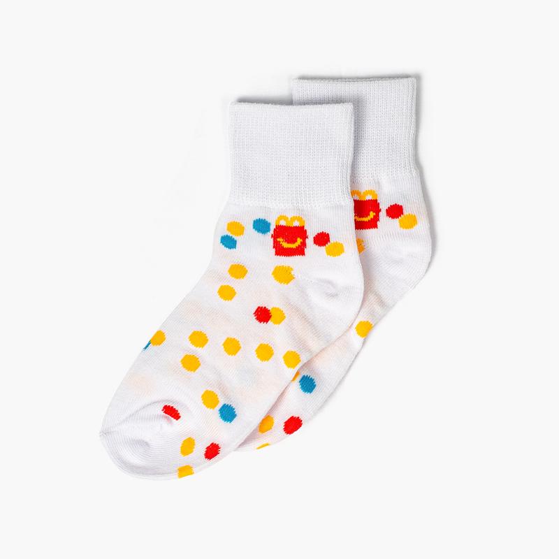 white ankle socks with confetti pattern and tiny Happy Meal graphic on left ankle