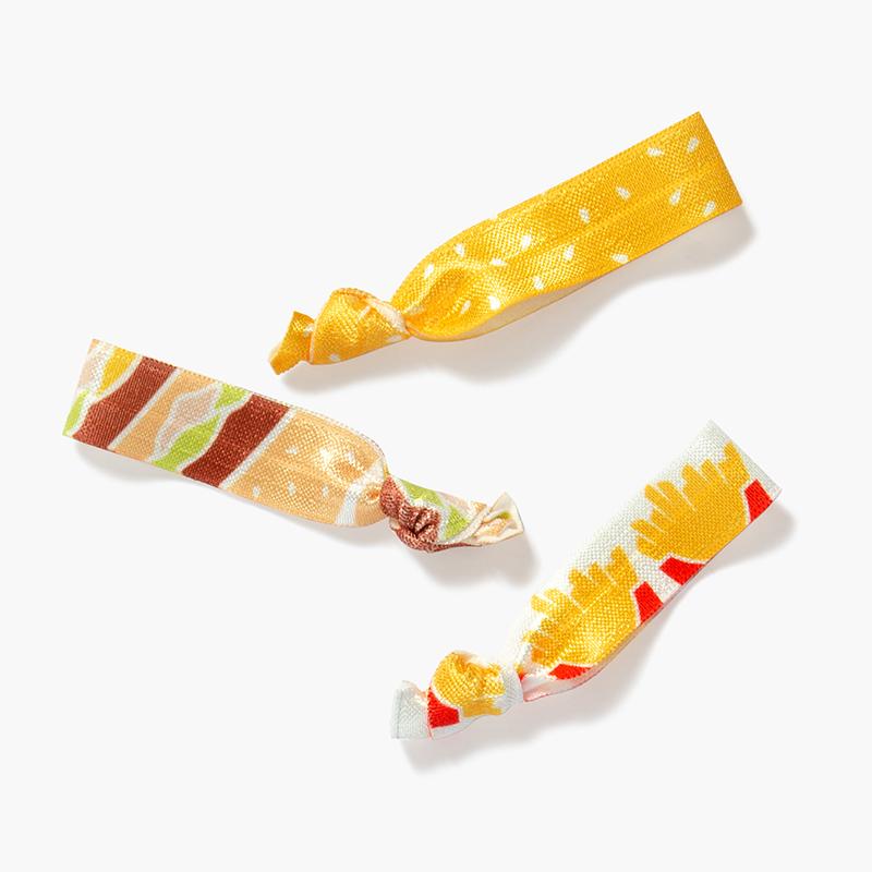 set of three hair ties in sesame seed, burger, and French fry print
